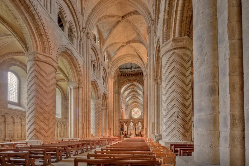 The great Norman nave of Durham Cathedral with carved zigzag pillars